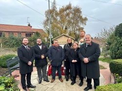 7 Members of Blidworth parish Council standing at Blidworth War Memorial